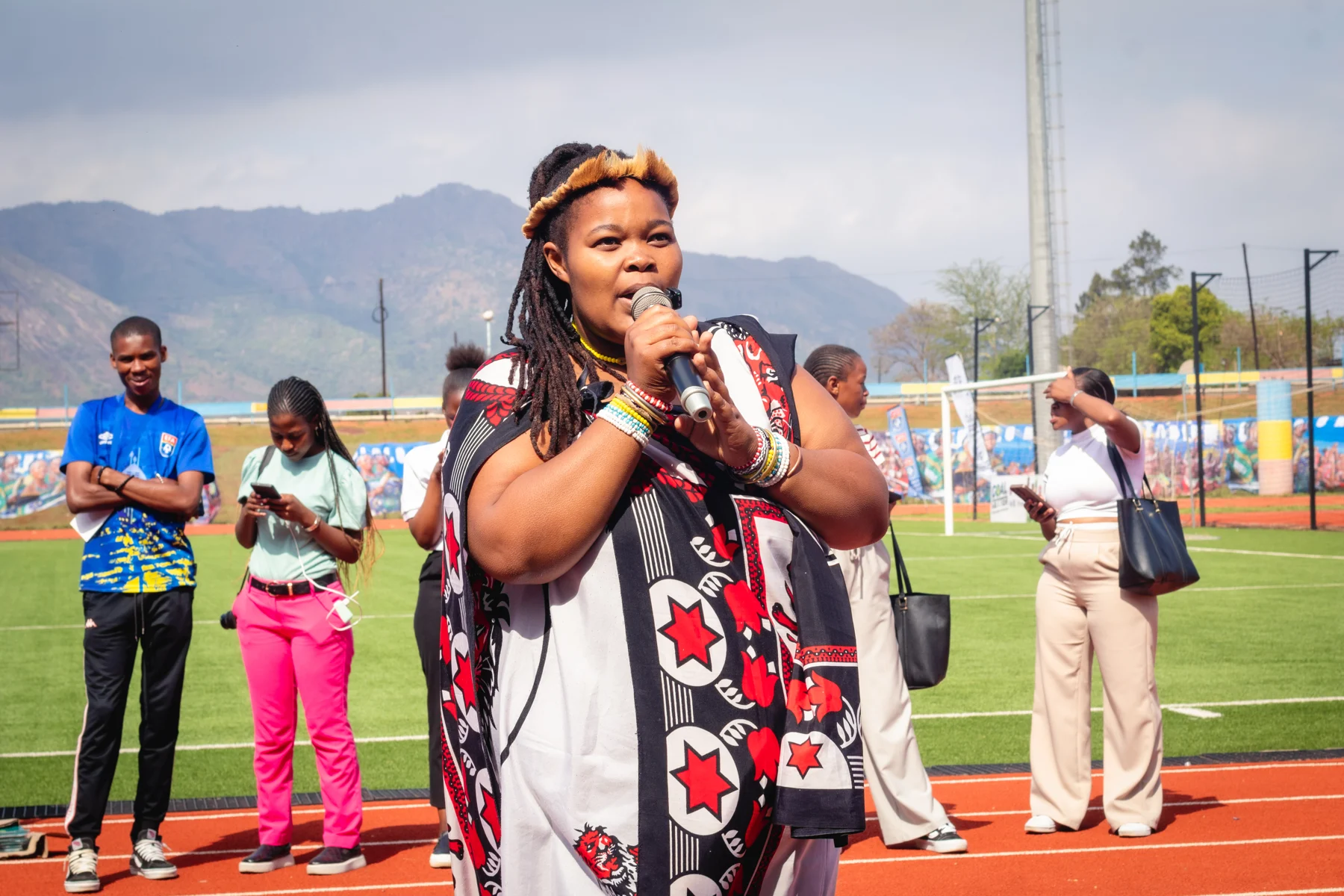 A speaker addressing the Goal Getters participants at the stadium